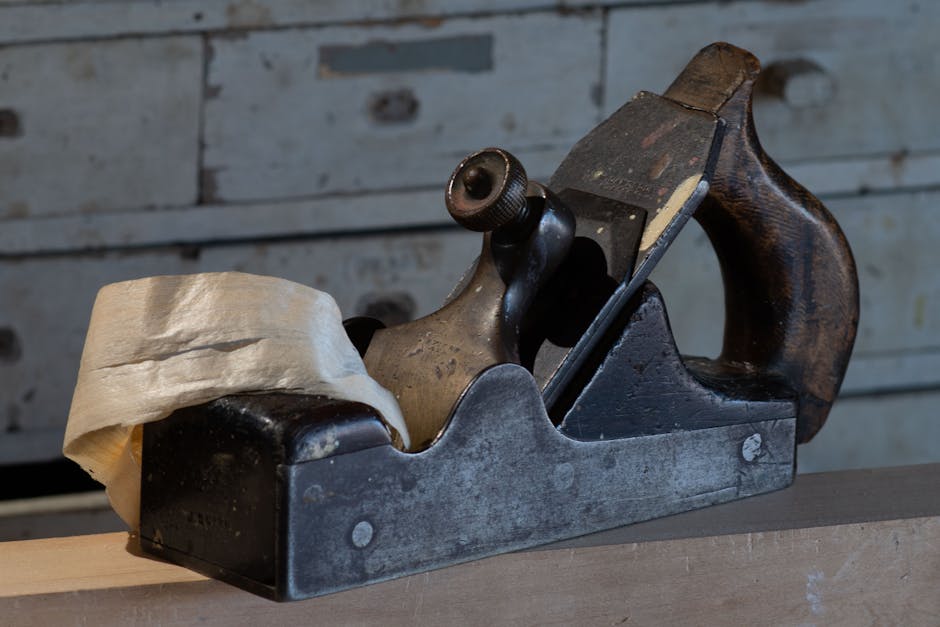 Classic wooden hand plane in a historic Ayr, Scotland woodshop, emphasizing craftsmanship.